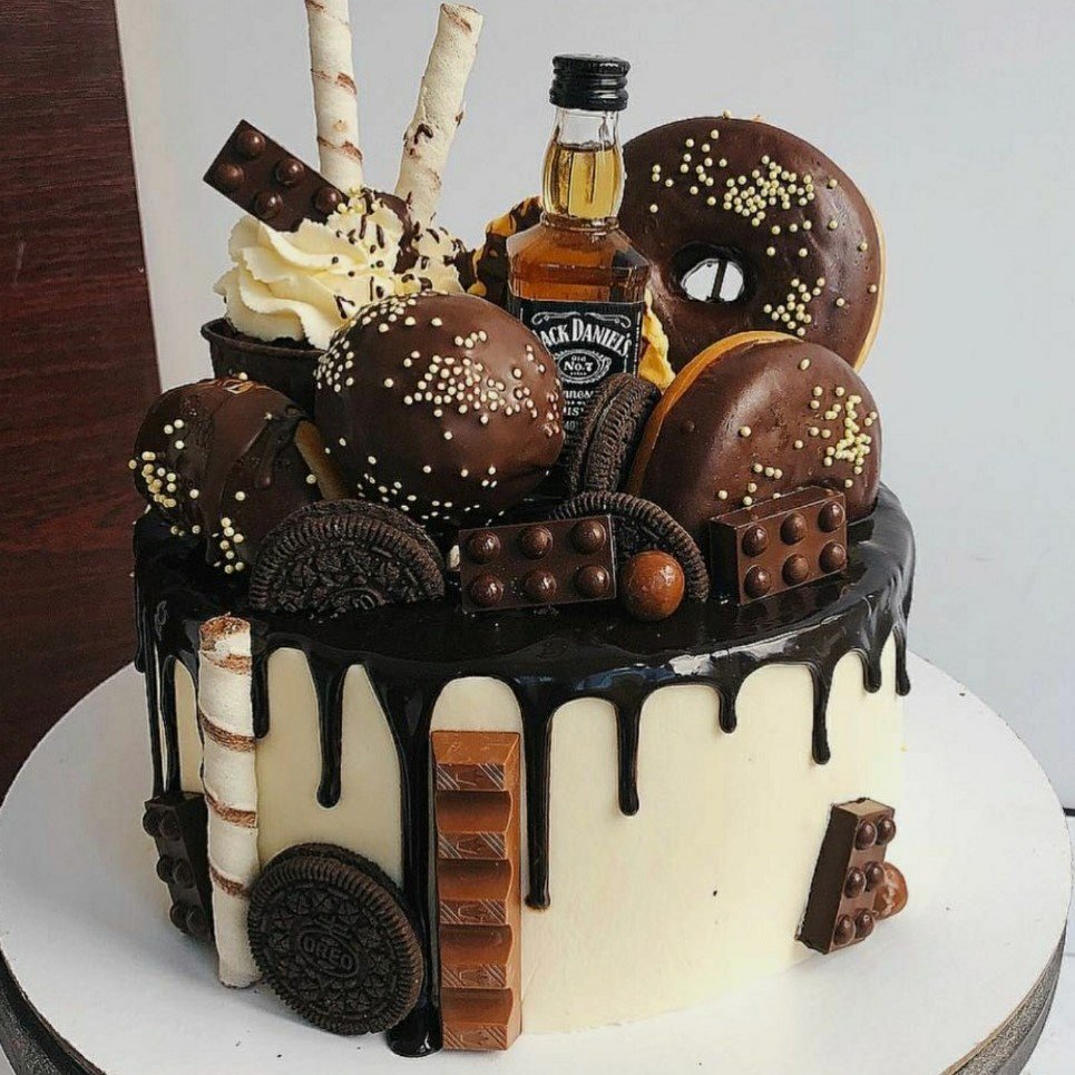 Drip alcoholic cake with liquor bottle chocolate drippy decorations